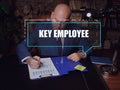KEY EMPLOYEE text in footnote block. Merchant checking financial report AÃÂ key employeeÃÂ is anÃÂ employeeÃÂ with major ownership Royalty Free Stock Photo
